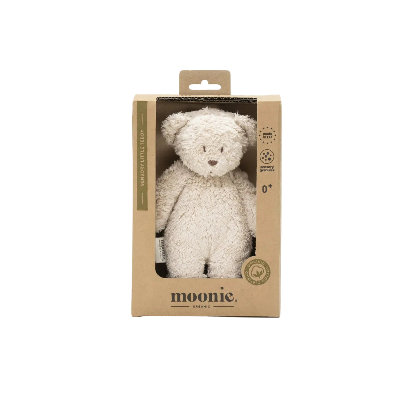 White teddy bear in a cardboard packaging with &