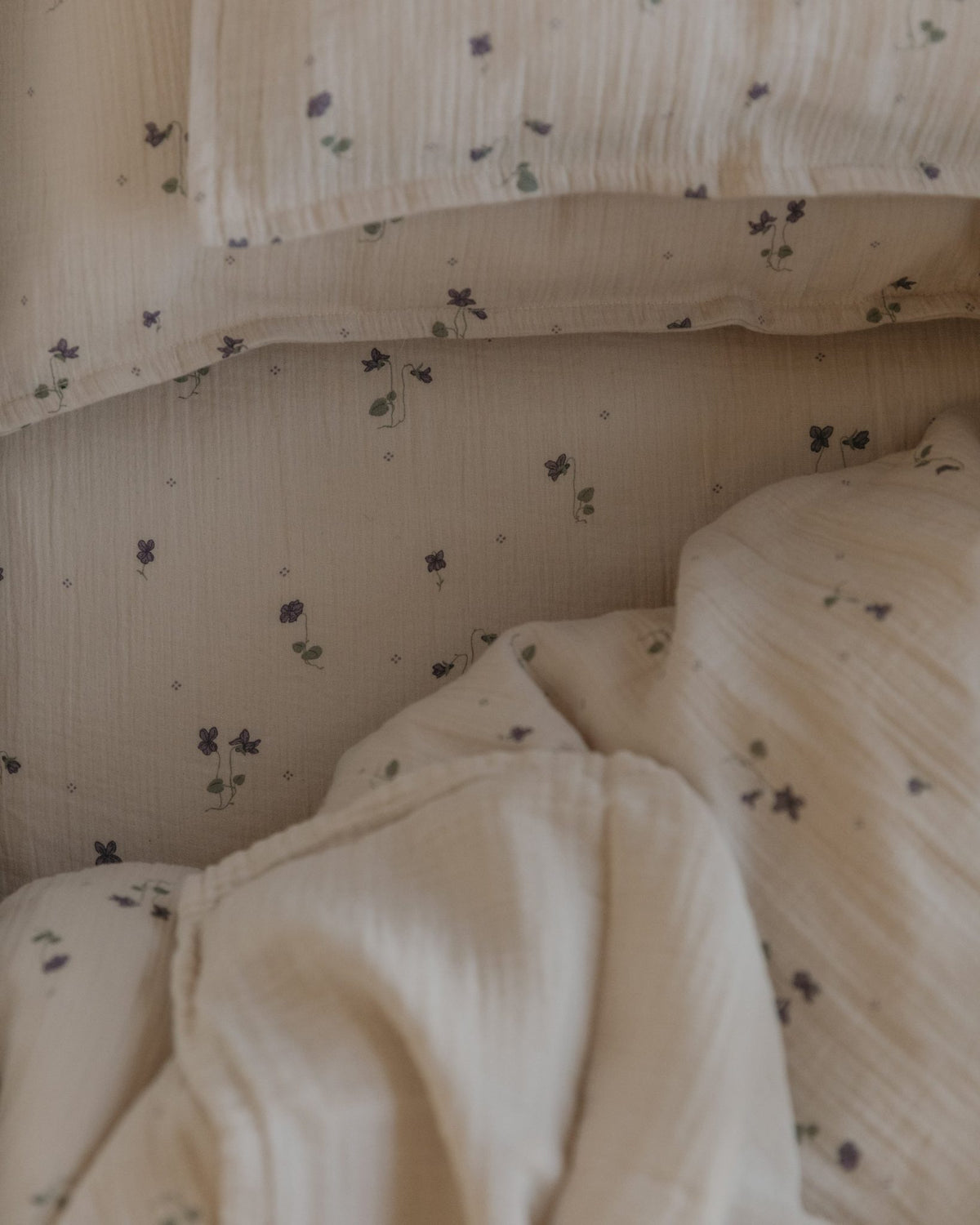 Close-up of the Garbo and Friends fitted sheet in the Viola print, The Archive Store