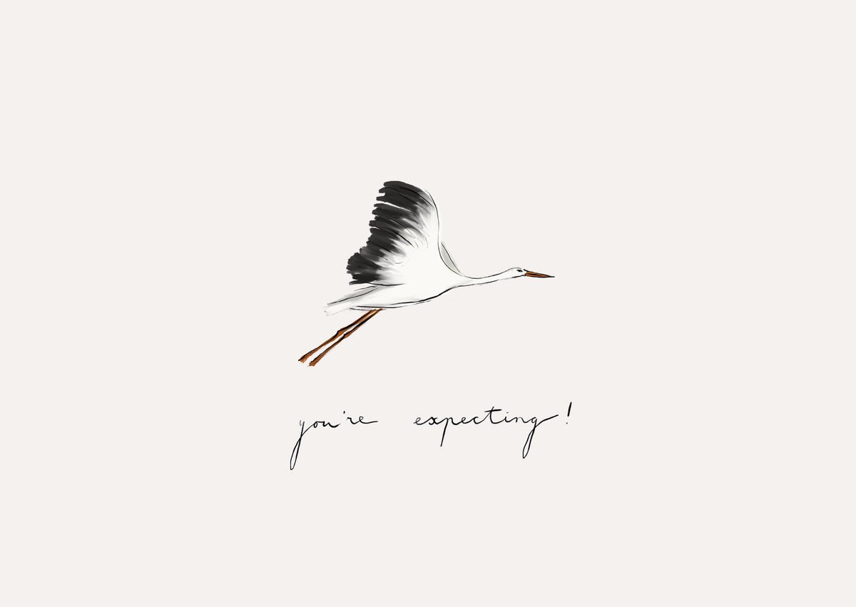 A minimalist art print featuring a black and white flying stork with orange accents, above the handwritten text &