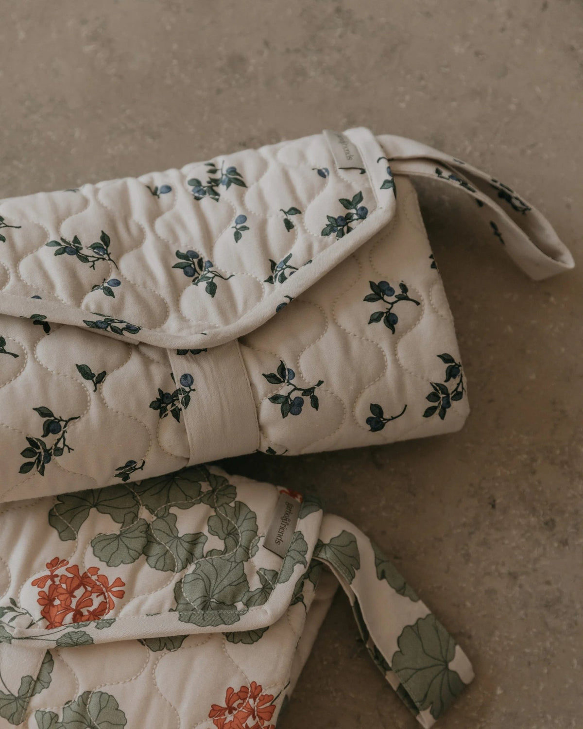 Garbo&Friends Change To Go changing pad in Blueberry print, lifestyle photo