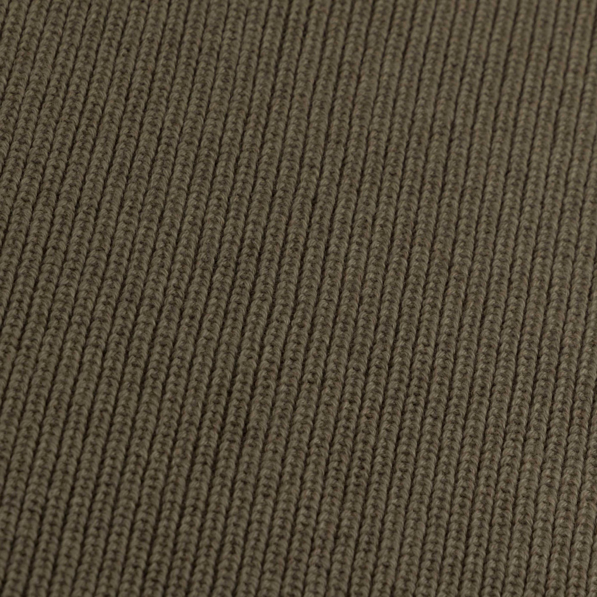 Close-up of the knitted merino wool fabric of the Hazel & George Georgia Merino Blanket in Mosswood