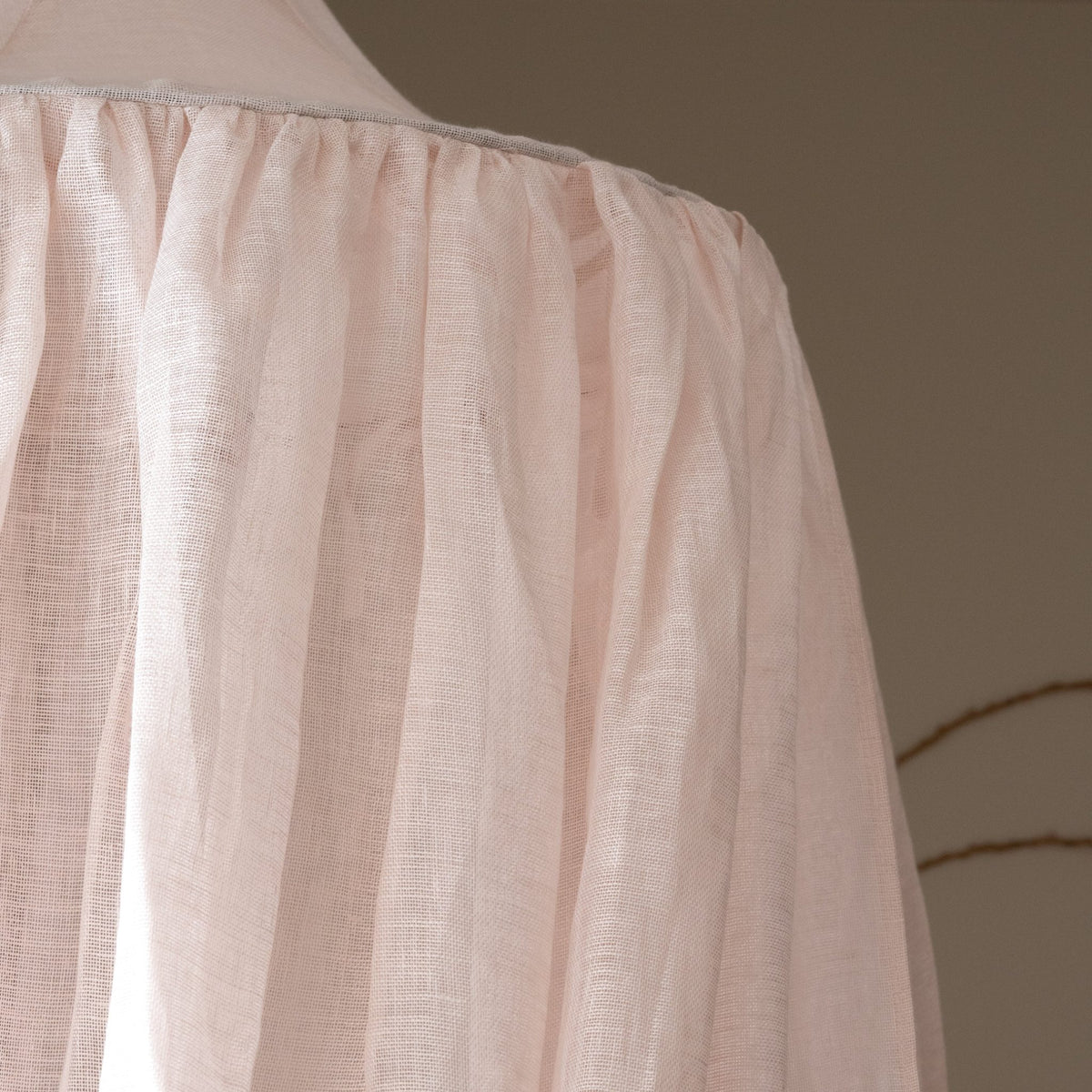 Close-up of the Hazel & George linen fabric in Craie, showing the sheer weave at the top of the canopy