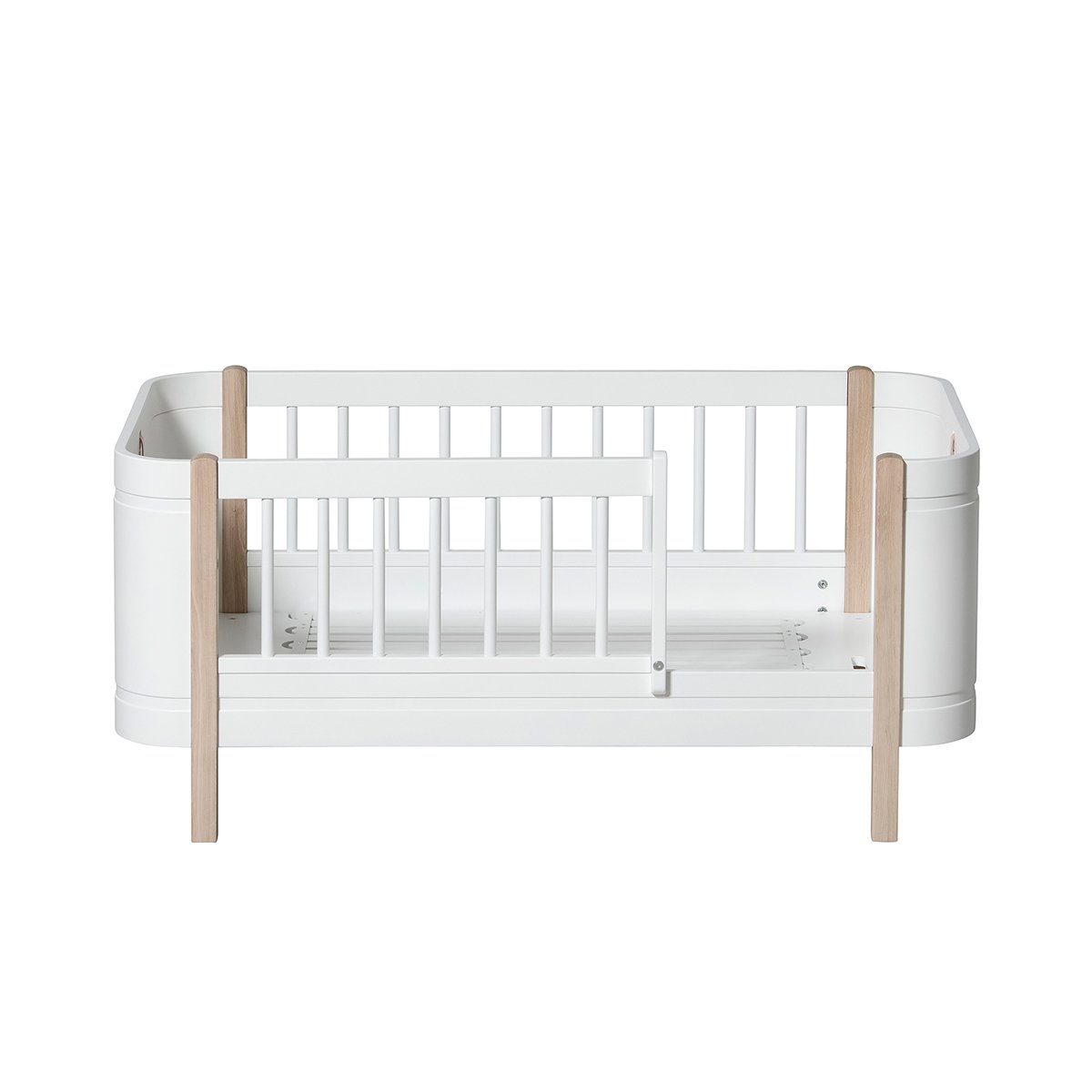 Wood Mini+ Cot Bed Incl. Junior Kit | White/Oak
