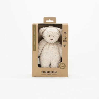 White teddy bear in a cardboard packaging with &