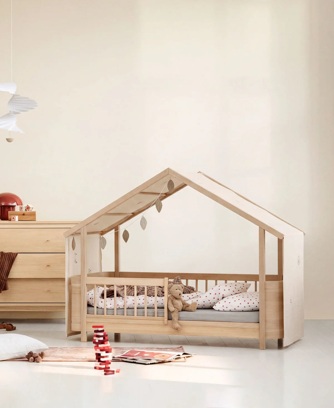 Oliver Furniture Wood Mini+ house bed in oak with the undyed canopy, styled in a children&