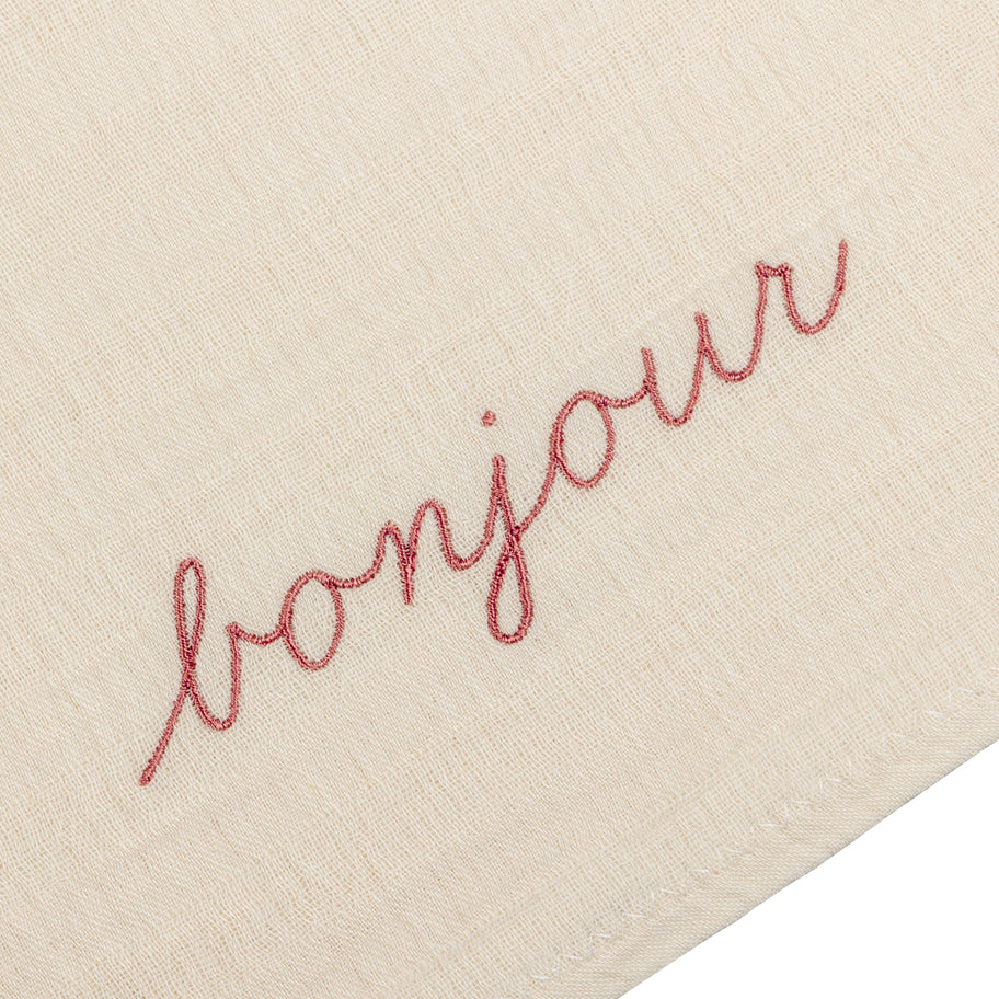 Baby swaddle of muslin with Bonjour embroidery in dusty pink by Annur for the Archive Store