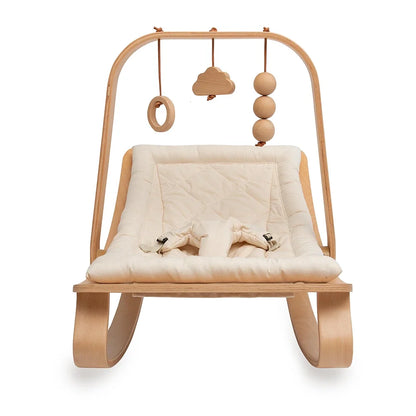 Charlie Crane LEVO activity arch in beech wood, front view on the LEVO rocker