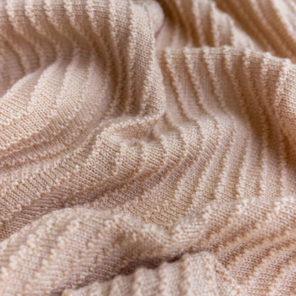 Fabric detail of Akira Baby Blanket from Hvid in the color Apricot