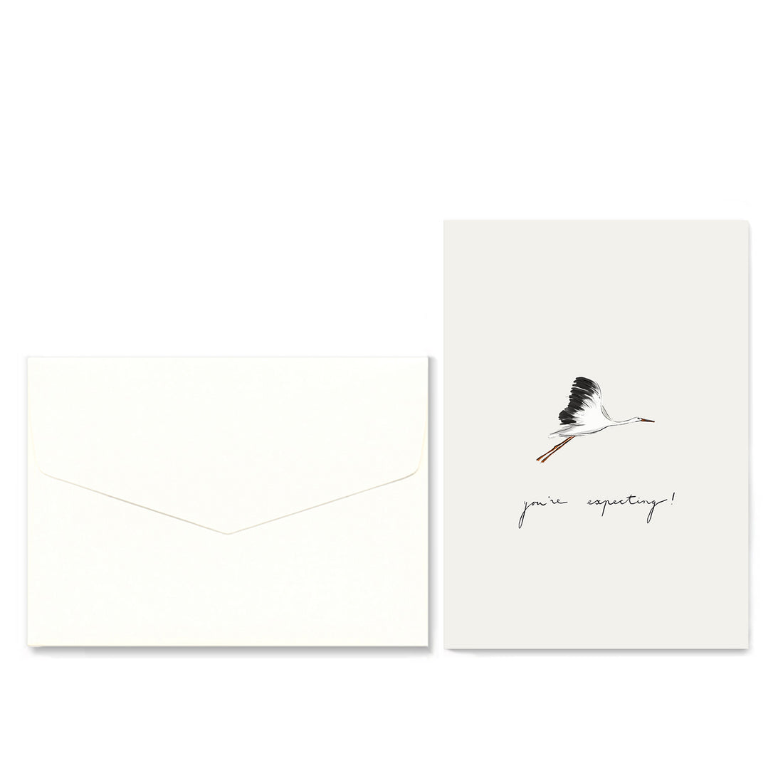 A minimalist greeting card and matching envelope set on a white background. The envelope is plain white, and the card features a small black-and-white flying stork illustration above the handwritten text &