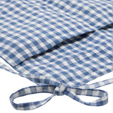 Close-up of the Hazel & George Linen Bed Pocket in Vichy, showing the folded pocket edge and ribbon tie in blue-and-white check
