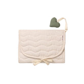 Beige quilted baby blanket with a heart-shaped pillow