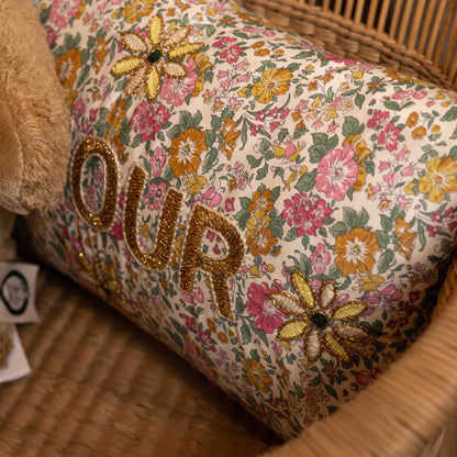 Floral-patterned cushion with embroidered &