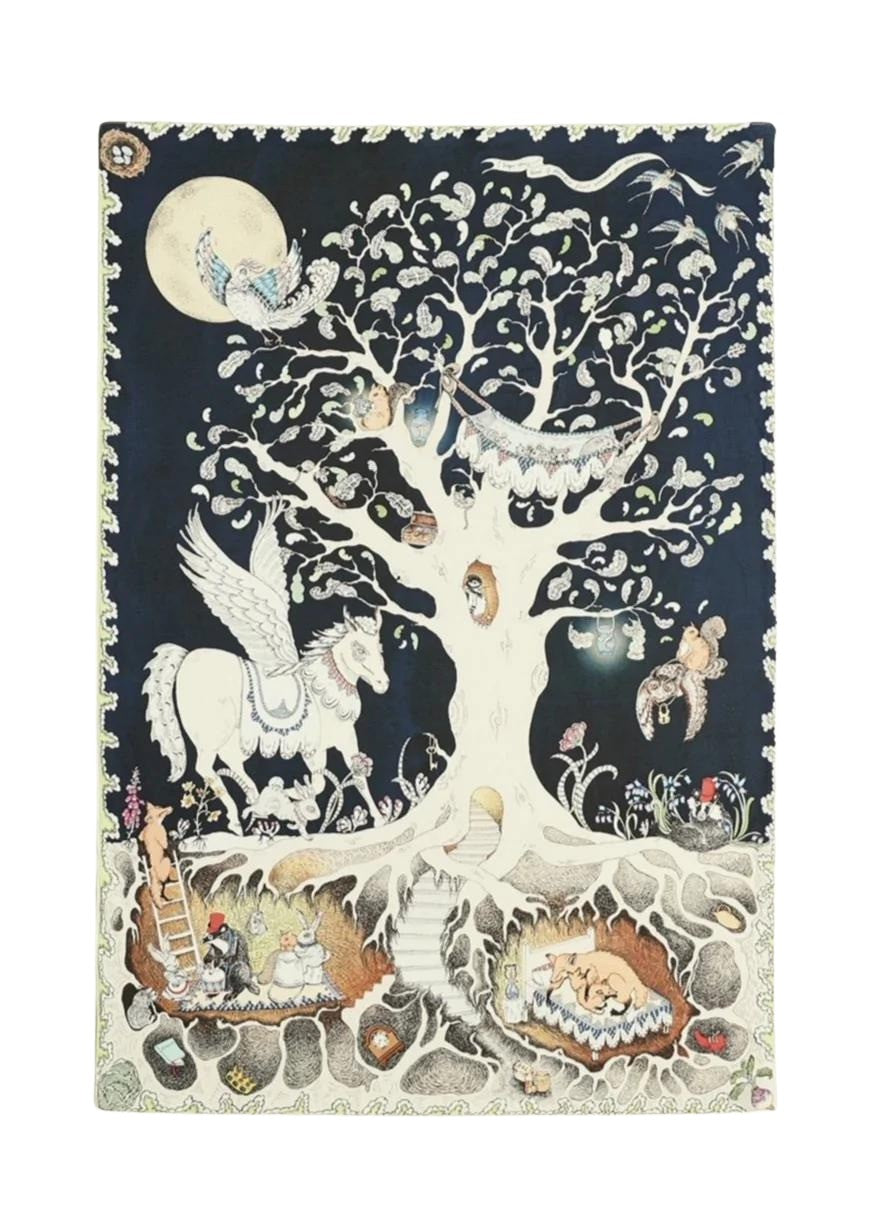A reversible baby muslin swaddle illustrated with a whimsical forest scene, showing daytime on one side and a magical night scene on the other.
