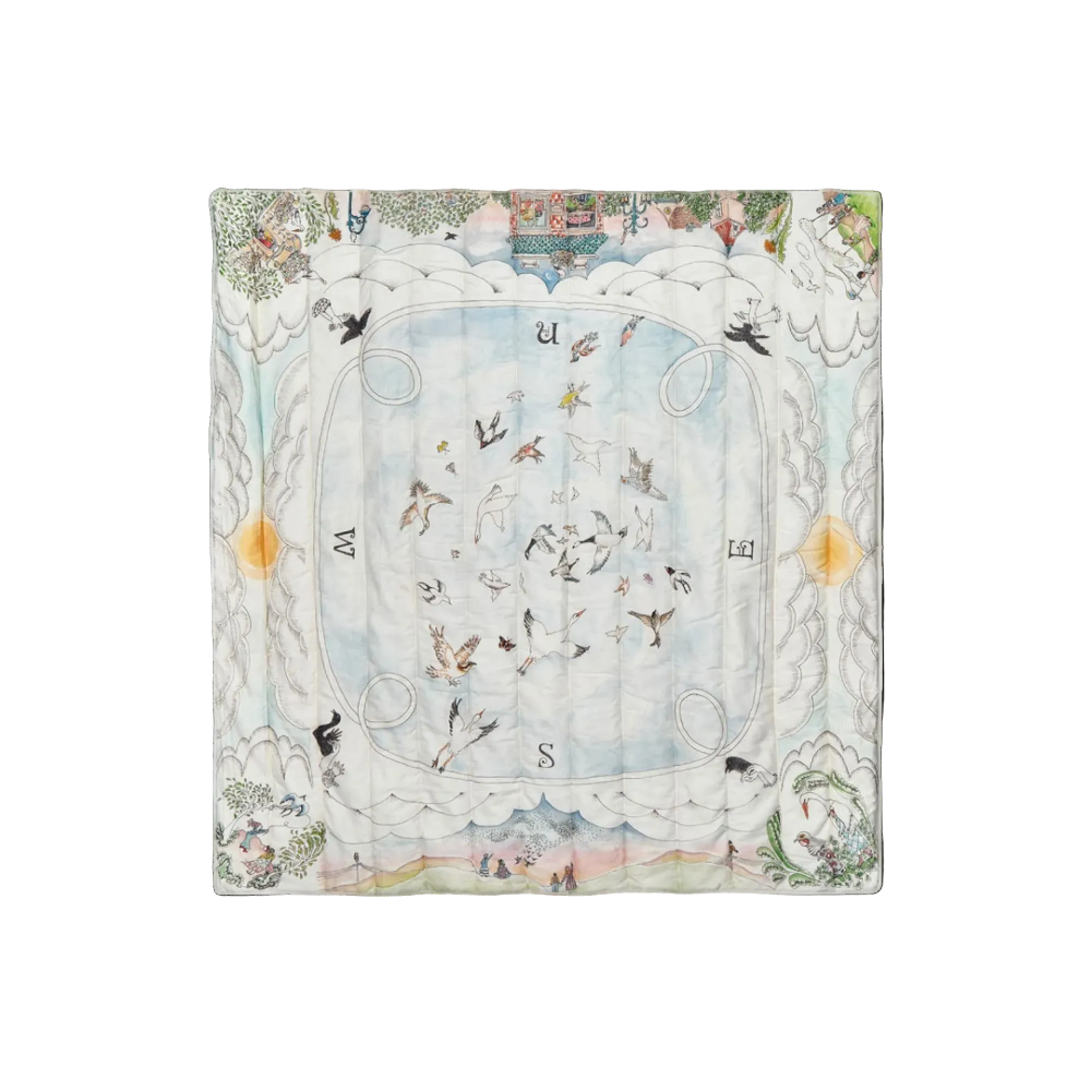 Decorative blanket with celestial design featuring constellations and birds