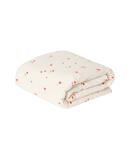 Garbo&amp;Friends Filled Blanket in Seersucker Poppy, shown flat on a white background