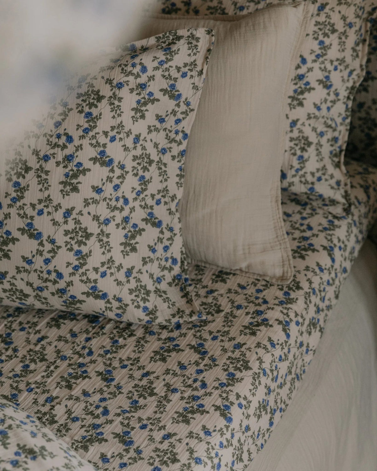 Detail of the Garbo and Friends muslin fitted sheet in the Dainty print, The Archive Store