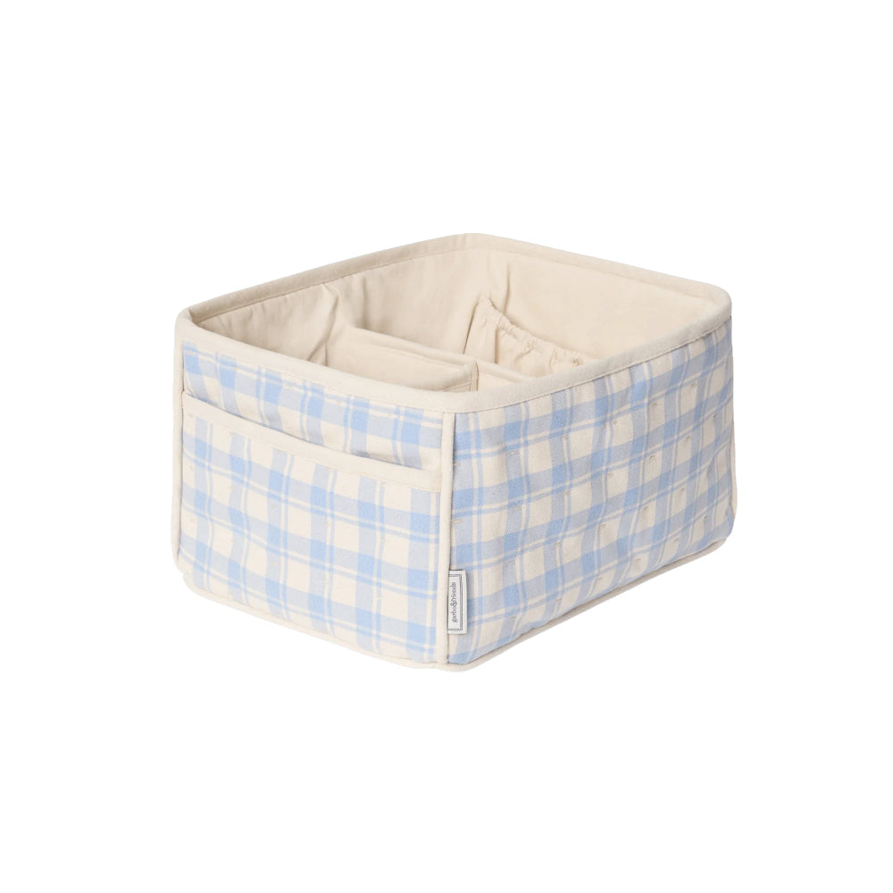 Storage bin with blue and white checkered pattern 