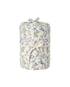 A rolled fabric item, likely a blanket or throw, featuring a delicate blue and gray floral print on a warm cream background, tied with a matching cream ribbon.