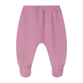 A pair of baby footed pants in a dusty pink color, featuring an elastic waistband and ribbed ankle cuffs