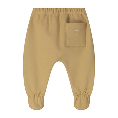 A pair of toddler pants in a warm tan or camel color, featuring an elastic waistband, a side pocket on the right leg, and elasticized cuffs at the ankles.