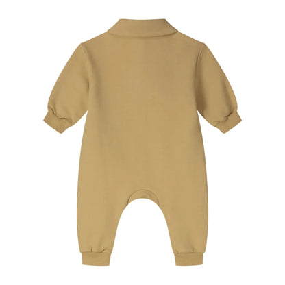 A mustard yellow baby long-sleeve footless romper