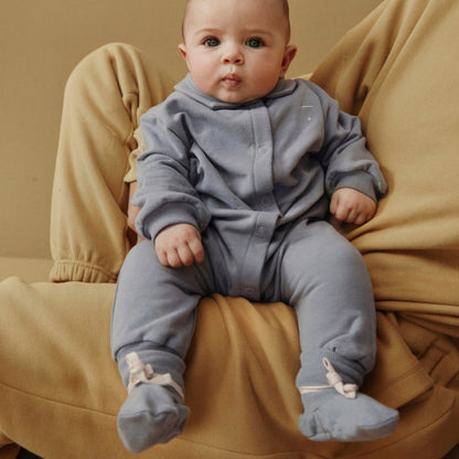 Baby in a gray romper