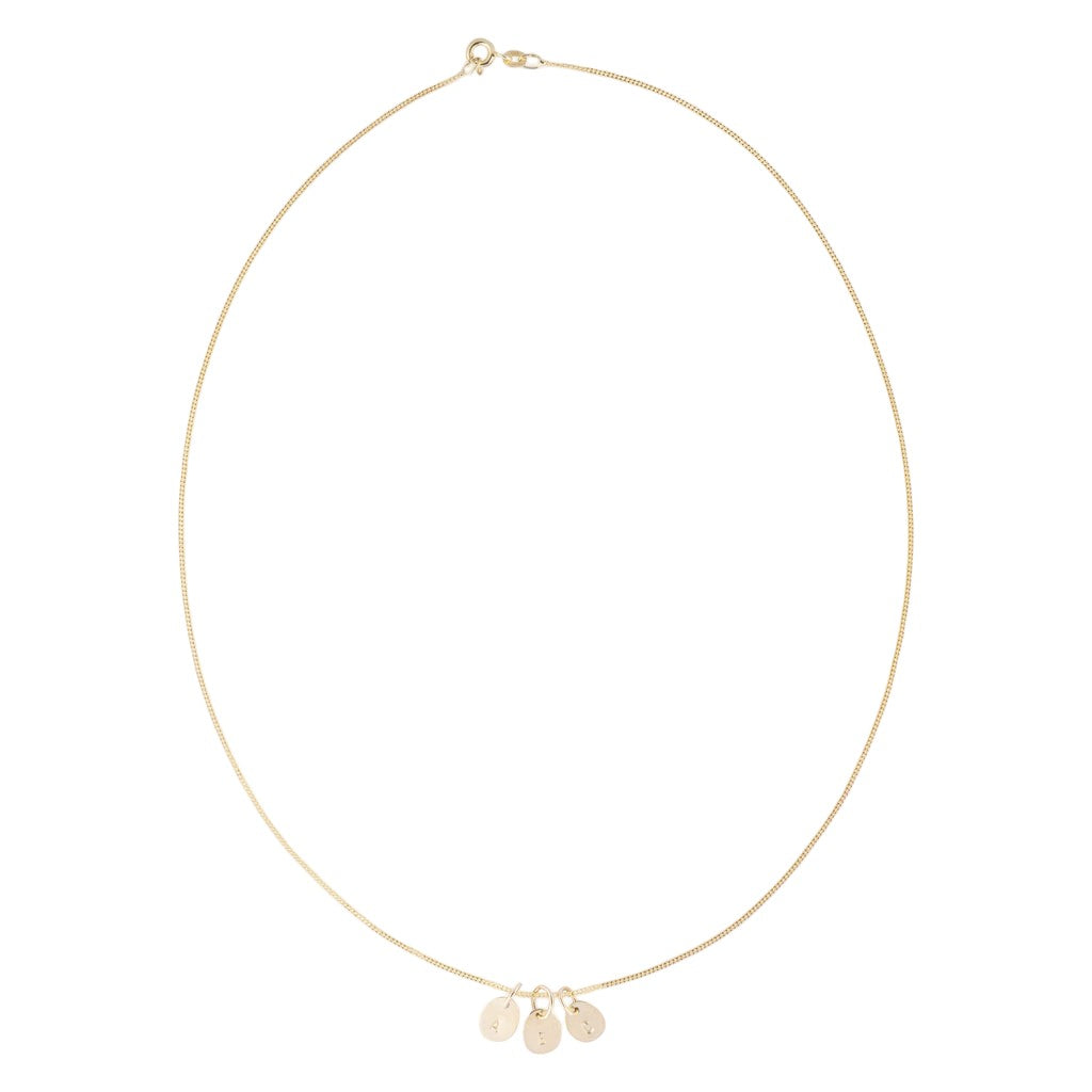 Hazel &amp; George Necklace 14K Gold, gold necklace worn in a circle with three small initial charms attached, on a white background