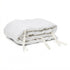 Hazel & George Linen Cover for Cot Bumper in Blanc, a padded linen bumper roll with white ties, folded on a white background