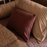Close-up of pillows on a sofa with a warm color palette
