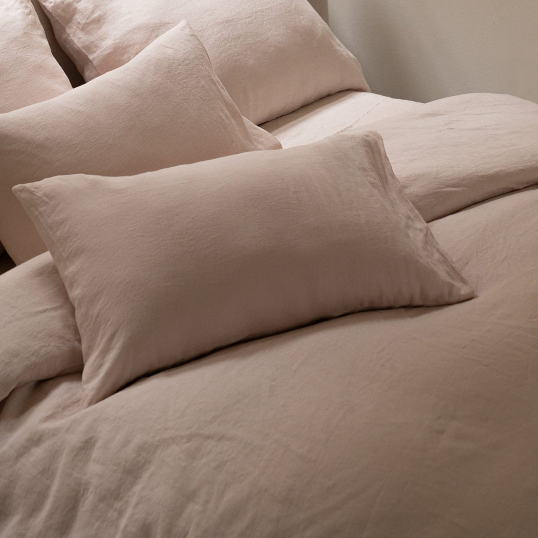 Bed styled with Hazel &amp; George linen bedding and pillows in Craie