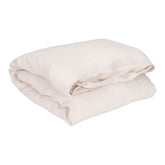 Hazel & George Linen Duvet Cover in Craie, folded, on a white background