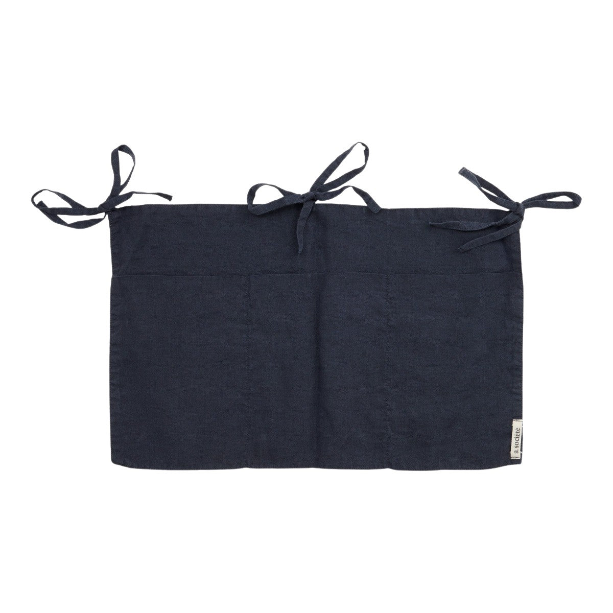 Hazel &amp; George Linen Bed Pocket in Off Black, a linen storage pocket with three ribbon ties and three compartments, on a white background