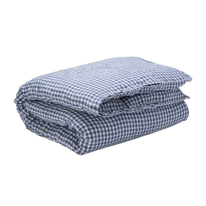 Hazel &amp; George Linen Duvet Cover in Vichy, folded, on a white background, showing the woven blue-and-white check pattern