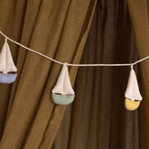 Cala Garland by Dear April with 6 fabric sailboats in green, yellow and blue