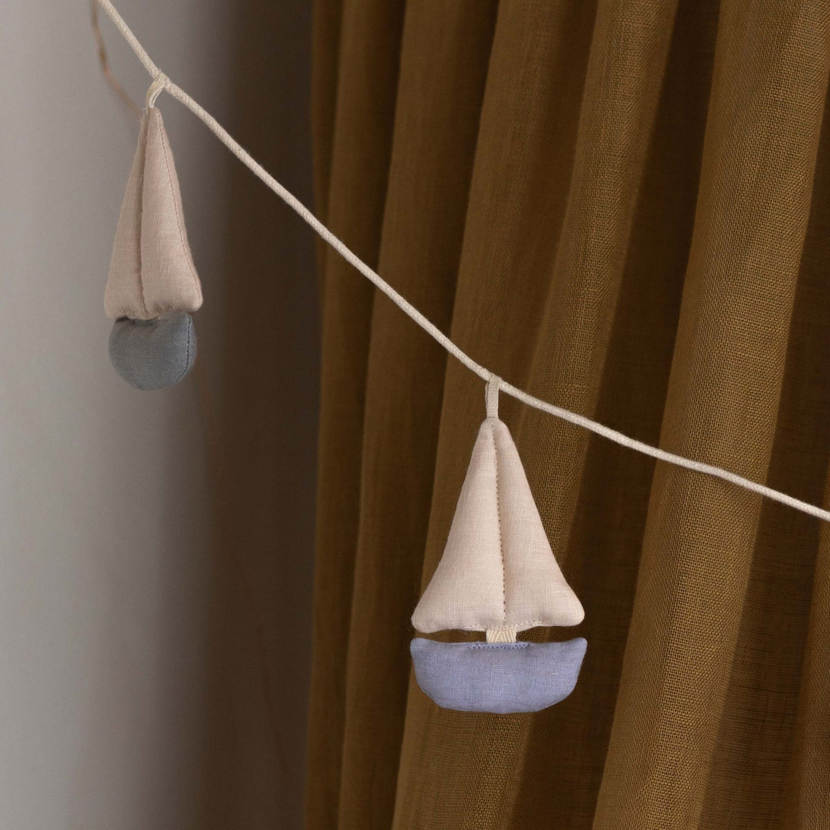 Cala Garland by Dear April, detail of a single fabric sailboat