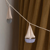 Cala Garland by Dear April, detail of a single fabric sailboat