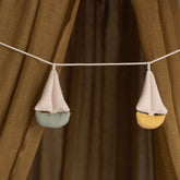 Cala Garland by Dear April, styled in a nursery
