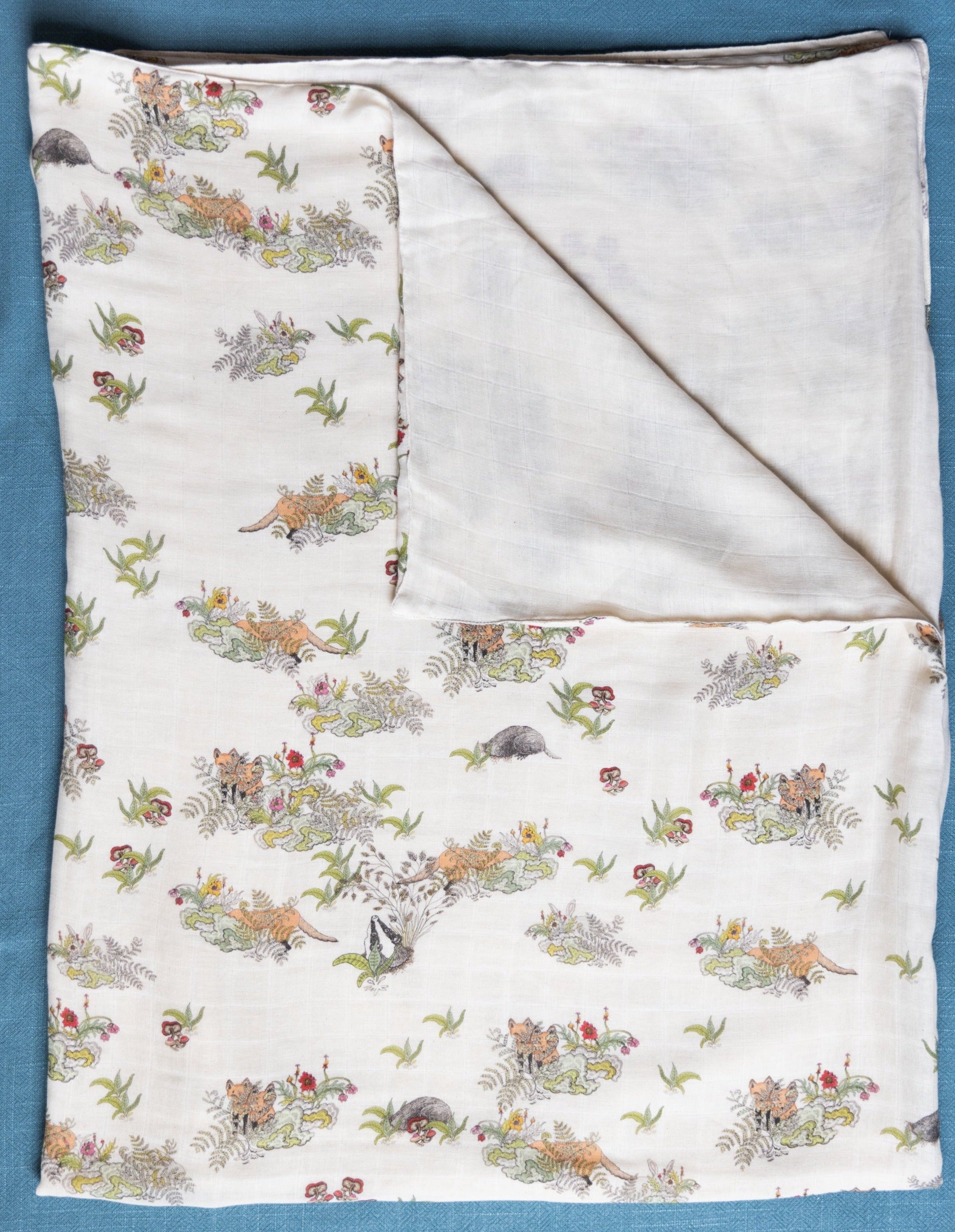 Soft Baby Muslin Swaddle with hiding foxes and rabbits by Forivor