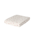 Garbo & Friends Muslin Changing Mat Cover Rosehip on a changing pad, ivory organic cotton muslin with small rosehip-red flowers