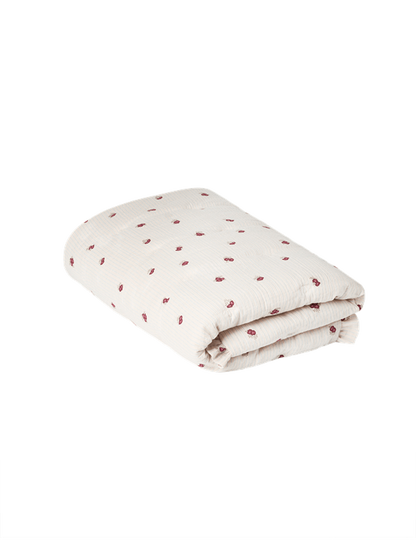 Garbo &amp; Friends Muslin Filled Blanket Rosehip, folded, ivory organic cotton muslin with small rosehip-red flowers