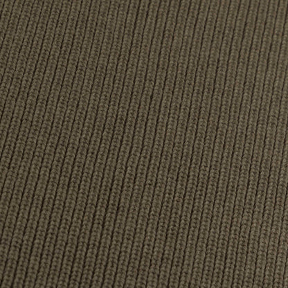 Close-up of the knitted merino wool fabric of the Hazel &amp; George Georgia Merino Blanket in Mosswood
