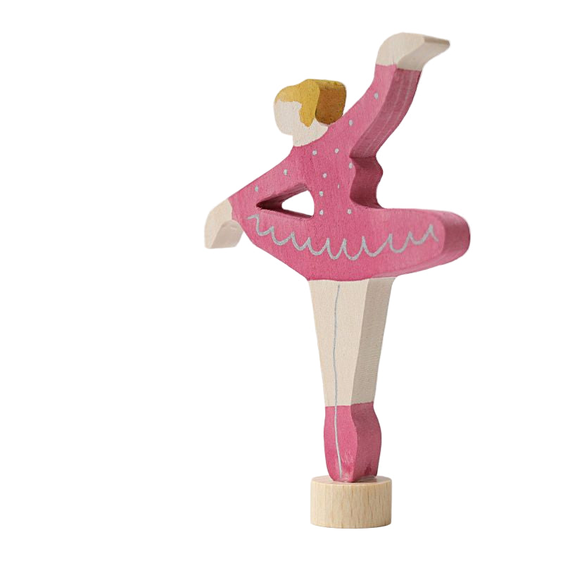 Wooden ballerina figurine in a pink outfit