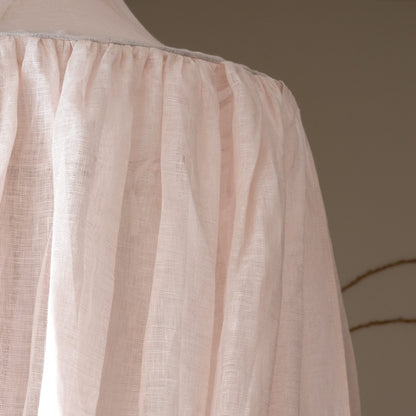 Close-up of the Hazel &amp; George linen fabric in Craie, showing the sheer weave at the top of the canopy