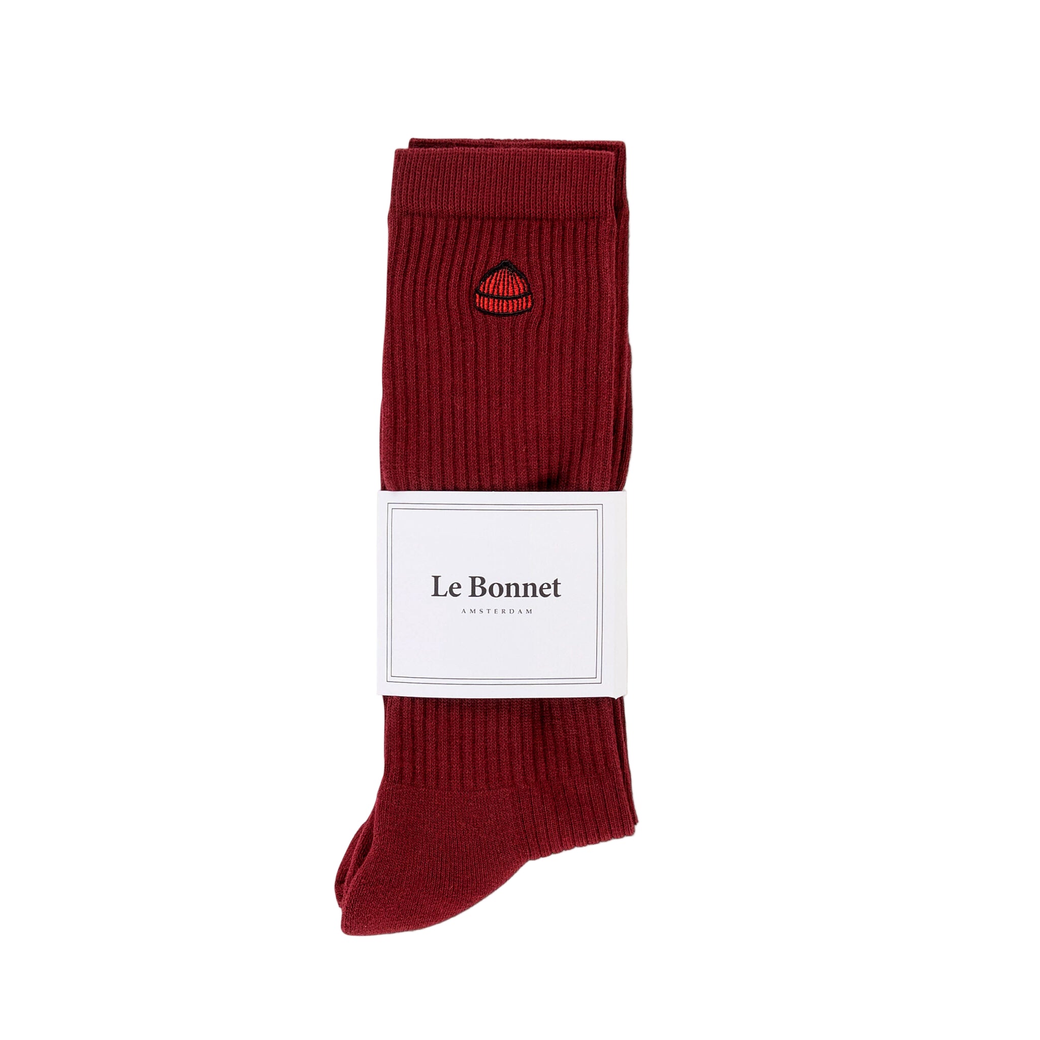 Red socks with a visible brand label