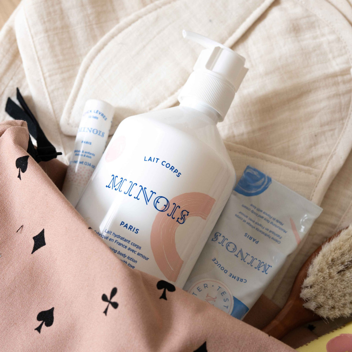Minois Paris Moisturizing Body Lotion bottle on a white background