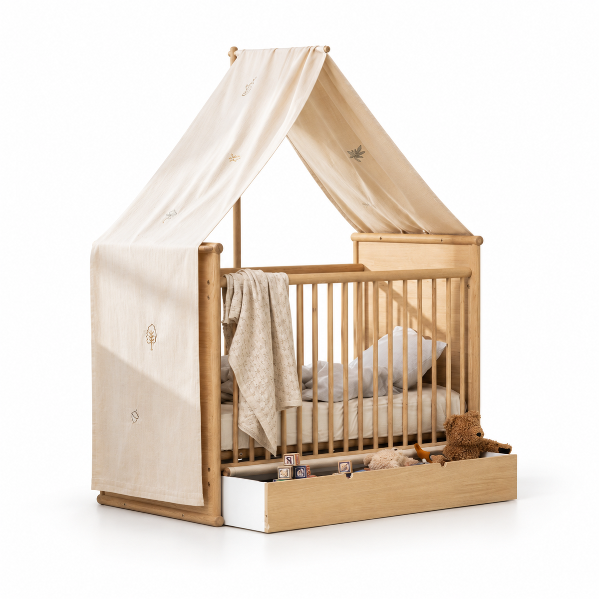 Oliver Furniture Camp Novel undyed embroidered canopy shown on an oak cot against a white background