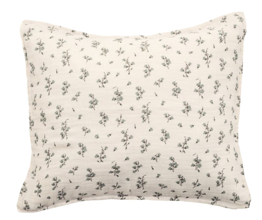 A white cotton pillowcase with a floral pattern in blue and green colors.