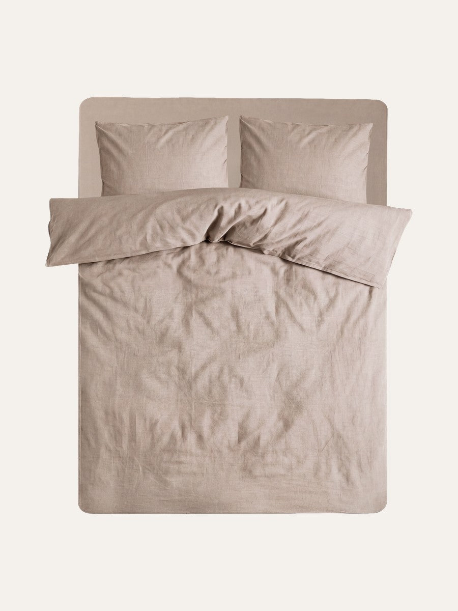 A grown-up bed in Hazel and George linen, ready to be composed