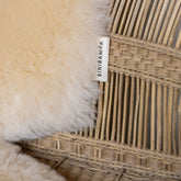 Close-up detail of the Binibamba sheepskin snuggler in Milk