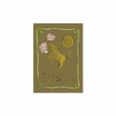 Hazel & George Taurus card featuring an illustration of a golden bull among clouds and a moon, with the constellation outlined below, on an olive green background